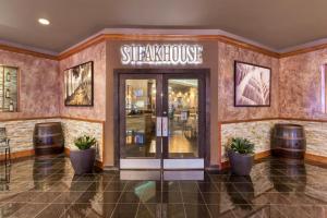 a entrance to a steakhouse with a sign that reads steakhouse at Best Western Plus Boomtown Casino Hotel in Verdi +104 photos