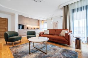 a living room with a couch and a table at APART 28 - Premium Suites in Podgorica