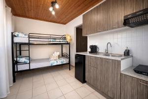 a kitchen with two bunk beds and a sink at Puerto Porto Koufo in Porto Koufo +23 photos