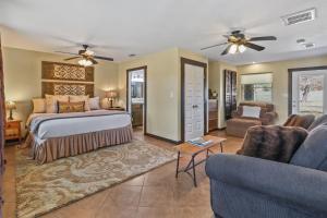 a bedroom with a bed and a living room at 2 Creeks in Wimberley