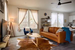 a living room with a couch and a table at A Stunning Escape in Canyon Lake