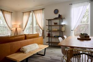 a living room with a couch and a table at A Stunning Escape in Canyon Lake