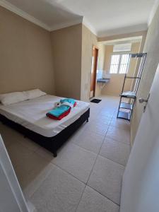 a bedroom with a bed and a ladder in it at Hostel Araguaia in Goiânia