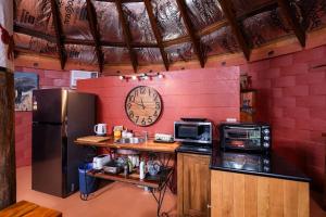 a kitchen with a large clock on the wall at Rileysview in Kilcoy