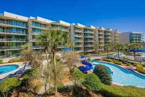 an apartment complex with a pool and a resort at Phoenix on the Bay 1213 in Orange Beach