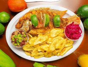 a plate of food with a fish and chips at Honduyate in Las Marías +17 photos