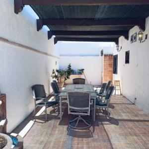 an outdoor patio with a table and chairs at Villa Serena Erizos 2 in San Carlos