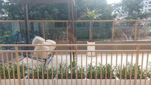 a balcony with a chair and a swing at Today Perdizes São Paulo - Allianz Parque in São Paulo