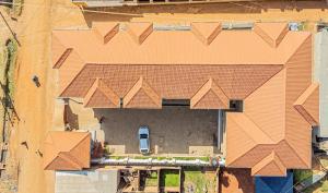 an overhead view of a house with a roof at Alma Hotels Kampala in Kampala