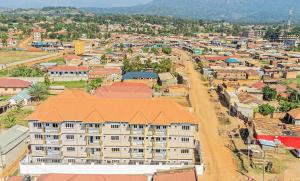 an aerial view of a town with a building at Alma Hotels Kampala in Kampala