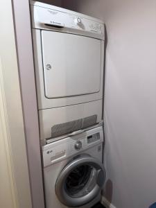 a washing machine and a dryer in a room at Trea Apartment in Tirana +24 photos