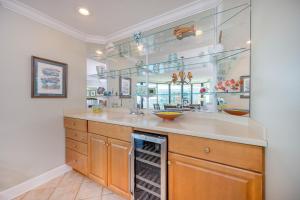 a kitchen with a sink and a counter top at Phoenix on the Bay 1405 in Orange Beach