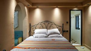 a bedroom with a large bed with white pillows at Bao Di East Coast in Honghai