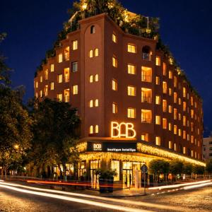 a large building with a steeple at night at BAB HOTEL Marrakech, Boutique Hôtel & SPA in Marrakesh