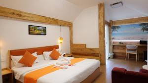 a bedroom with a bed with a stuffed animal on it at Koh Rong New Beach Resort in Koh Rong Island +136 photos