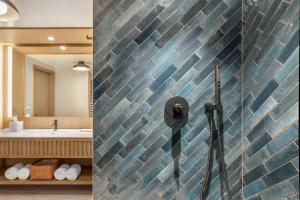 two pictures of a bathroom with a tile wall at Hilton Club Ka Haku Honolulu in Honolulu +23 photos