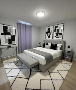 a bedroom with a large bed and a rug at Modern 2BR 2BA Apartment Garden-View in San Francisco