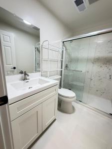 a bathroom with a sink and a toilet and a shower at Modern 2BR 2BA Apartment Garden-View in San Francisco