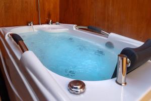 a bath tub with a sink and a bath tub at Glamping Trailer Lanikai in Awaji +38 photos
