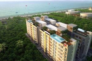 an overhead view of a building next to the beach at Beautiful Sandy Jomtien Beach Pattaya at NeO Seaview Condo in Jomtien Beach