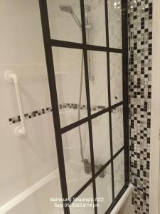 a shower with a glass separator in a bathroom at Shauna's house in Poole