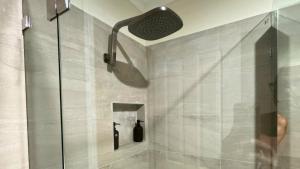 a shower with a glass door in a bathroom at Beach Haven in Bunbury +57 photos