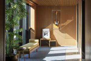 a living room with a guitar on the wall at THE AOYAMA GRAND HOTEL in Tokyo