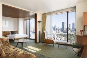 a hotel room with a bed and a large window at THE AOYAMA GRAND HOTEL in Tokyo