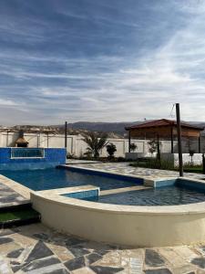 a swimming pool in the middle of a building at Rest Sea Chaliet & Farm in Edh Dhrā‘