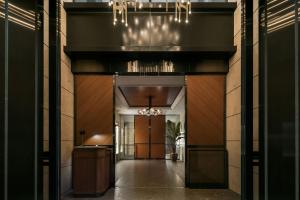 a hallway leading to a building with a hallwayngth at THE AOYAMA GRAND HOTEL in Tokyo