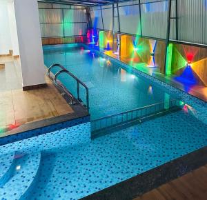 an empty swimming pool in a building at Melanna Cherai Beach in Cherai Beach