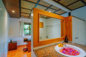 a bathroom with a sink and a mirror at Unik Cottage in Sidemen +29 photos