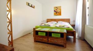a bedroom with a bed and a wooden table at Appartement Veronika in Öblarn