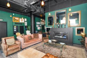 a living room filled with furniture and a fireplace at McCormick Suites by Slumber Stay in Chicago