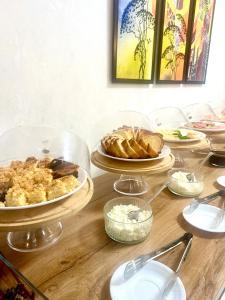 a table with plates of food on top of it at Boston Hotel Tashkent in Yakkasaray