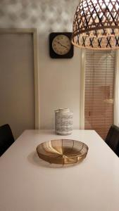 a table with a wooden bowl on top of it at 't Behouden huys in Hollum