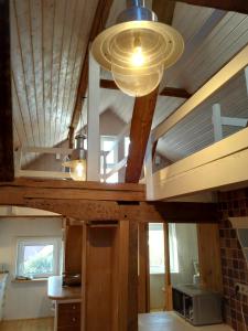 a kitchen with a vaulted ceiling with a microwave at Ferienhaus Landhaus Am Hirtzborn in Marburg an der Lahn