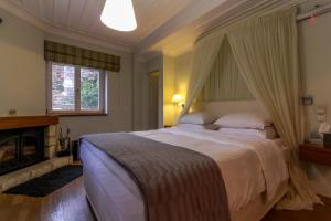 Posteľ alebo postele v izbe v ubytovaní Enastron Guesthouse