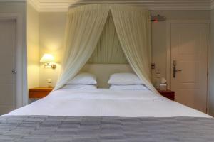 Posteľ alebo postele v izbe v ubytovaní Enastron Guesthouse