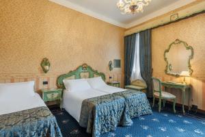 Postel nebo postele na pokoji v ubytování Hotel Montecarlo
