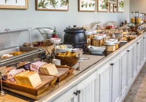 a buffet line with many different types of food at Hotel Ambassador Varanasi in Varanasi