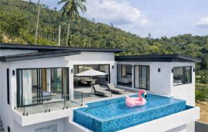 a house with a swimming pool with a pink duck in the water at Sea view Villa Josefina - 3 bedroom in Nathon Bay