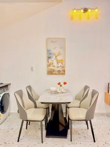 a dining room with a table and chairs at The Sun Avenue - TPHomes in Ho Chi Minh City