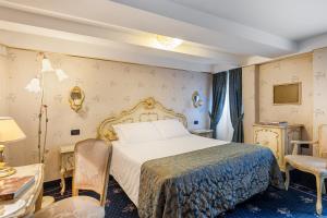 Postel nebo postele na pokoji v ubytování Hotel Montecarlo