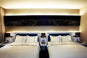 Postel nebo postele na pokoji v ubytování Airline Inn Green Park Way