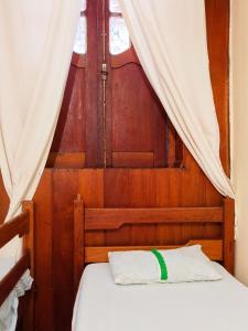 Tempat tidur dalam kamar di Hostel Amazonia