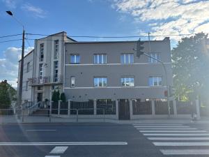 a building on the corner of a street with a traffic light at BeskidPark in Bielsko-Biała