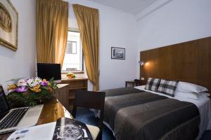 Llit o llits en una habitació de Hotel De Petris