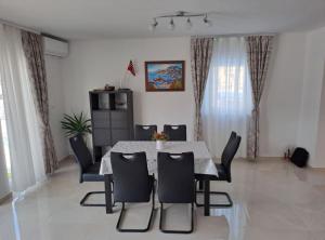 a dining room with a table and chairs at Apartment Freya in Zadoborje