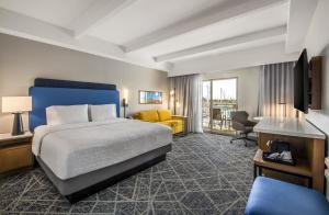 a hotel room with a bed and a television at Hampton Inn Channel Islands Harbor in Oxnard +50 photos